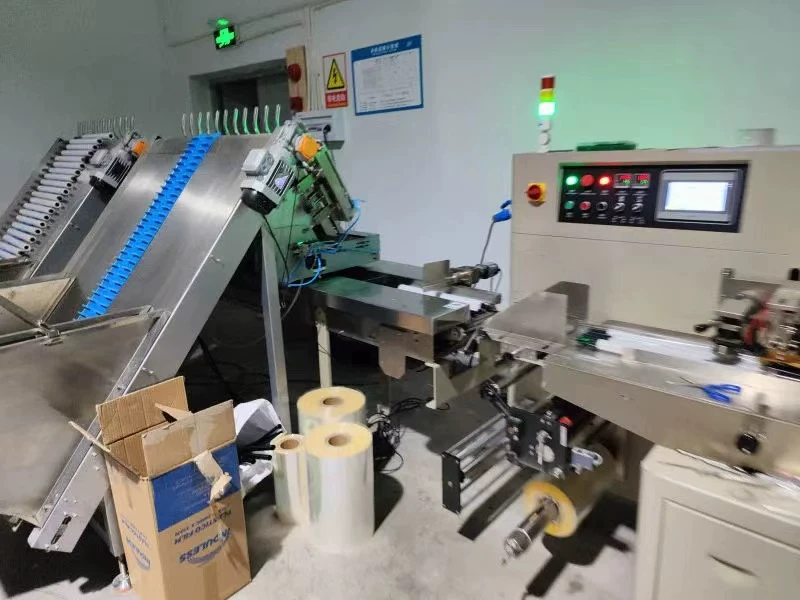 Automatic horizontal flow wrapping line installed at a customer production site