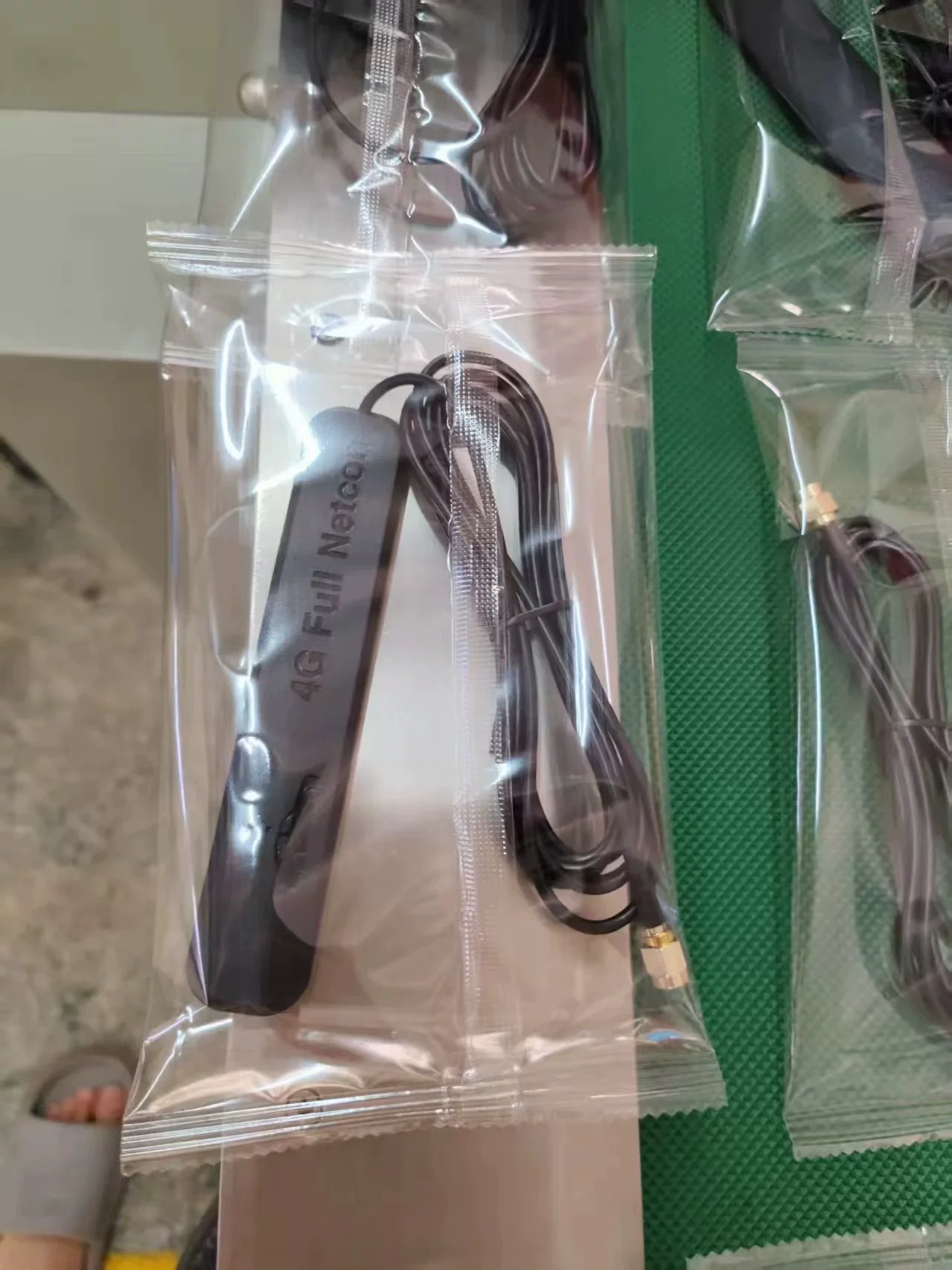 Data cable sealed in a clear flow wrap pillow package